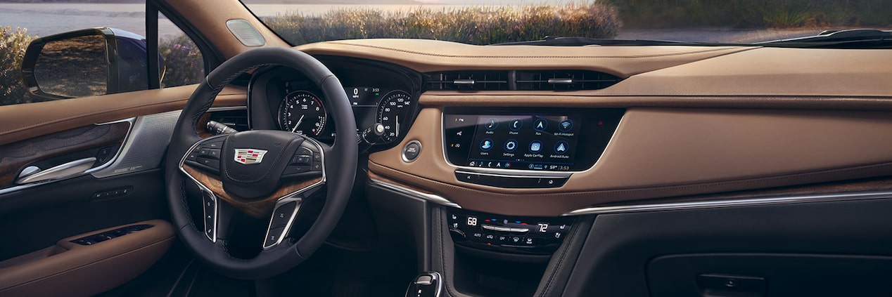 2024 Cadillac XT5 steering wheel and centre console overview.