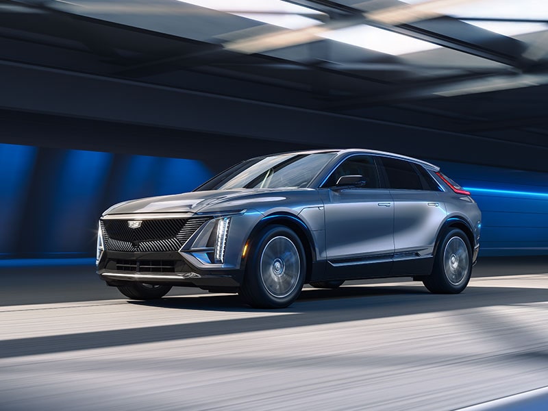 A 2025 Cadillac LYRIQ driving fast on a tunnel.