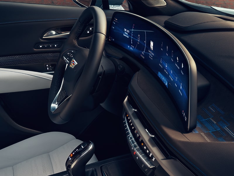 Side view of the curved 33" diagonal LED display inside the 2025 Cadillac XT4. 