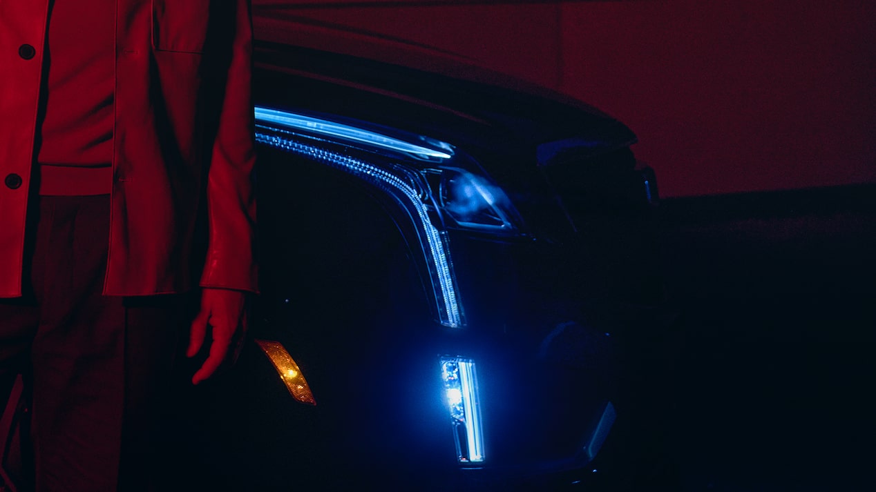 Intellibeam lights on the 2025 Cadillac XT5 luxury SUV turning on at night.