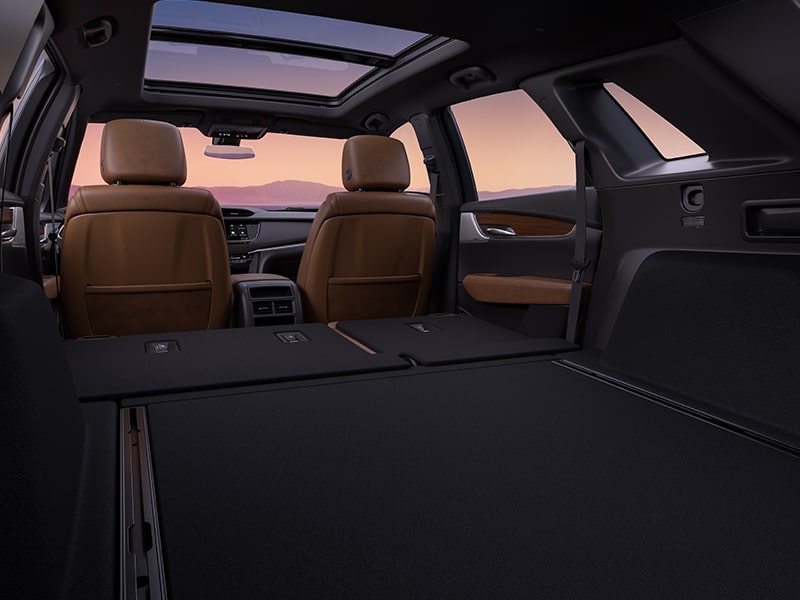 Rear seats folded in the interiors of the 2025 Cadillac XT5 luxury SUV.