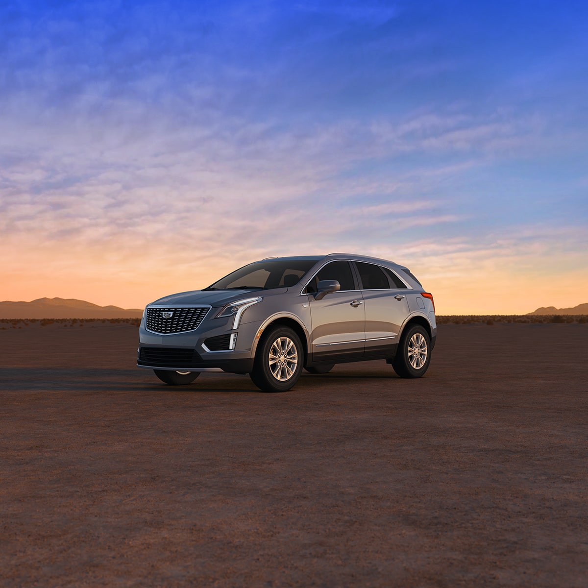 2025 Cadillac XT5 luxury SUV parked alone outdoors during sunrise.