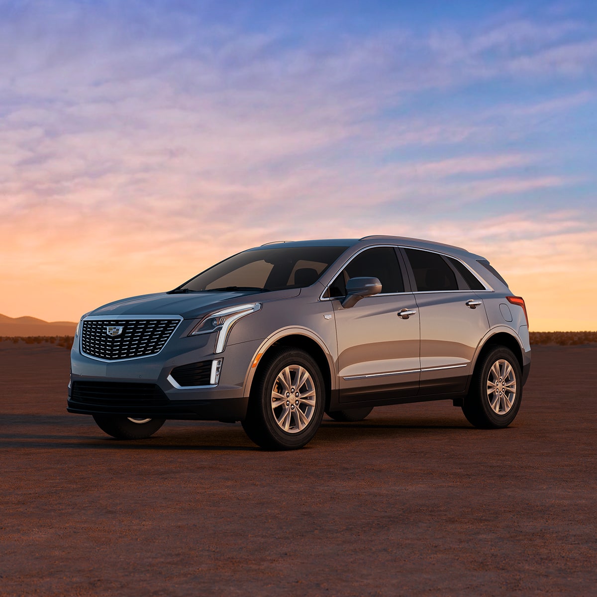 2025 Cadillac XT5 luxury SUV parked alone outdoors during sunrise.