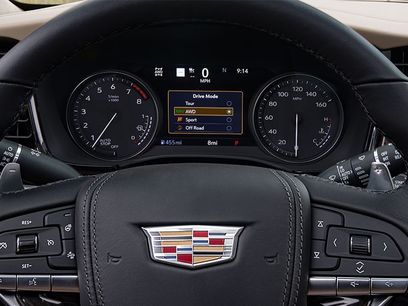 Vue rapprochée du sélecteur de mode de conduite avec le tableau de bord du VUS intermédiaire 7 passagers Cadillac XT6 2025.