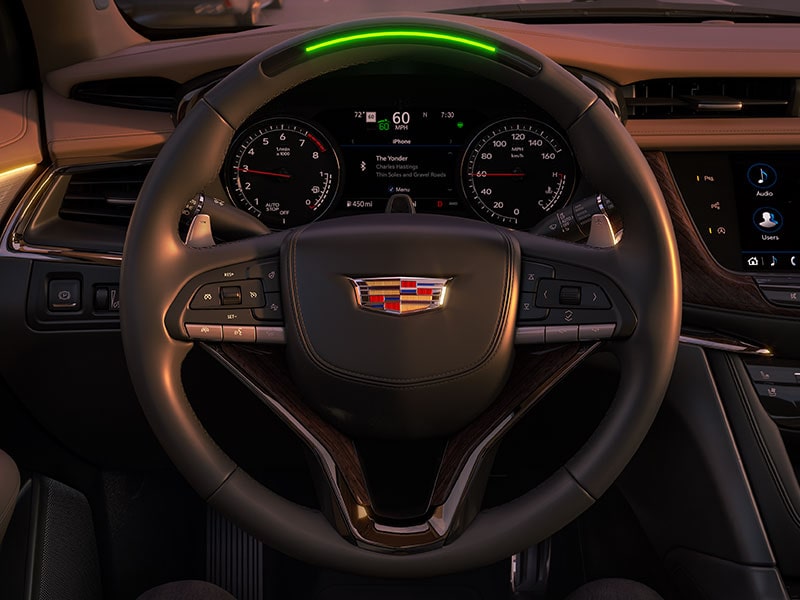 Driver's view of the Super Cruise hands-free steering wheel on the 2025 Cadillac XT6 mid-size 7 passenger SUV.