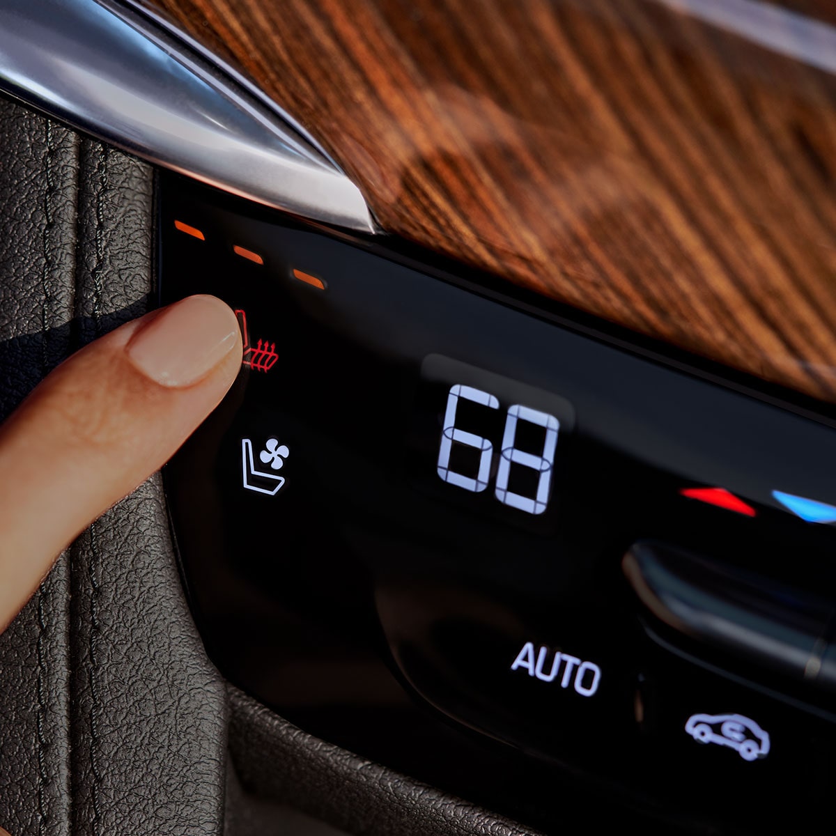 Close up view of the button options on the seats of the 2025 Cadillac XT6 mid-size 7 passenger SUV.