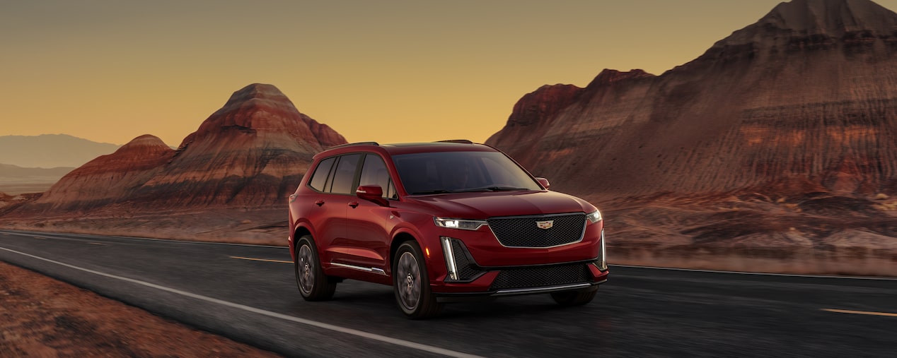 The Intellibeam of the 2025 Cadillac XT6 mid-size 7 passenger SUV activating at night.