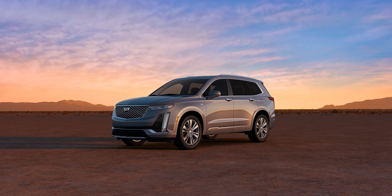 Front-side view of the 2025 Cadillac XT6 mid-size 7 passenger SUV parked alone outdoors.