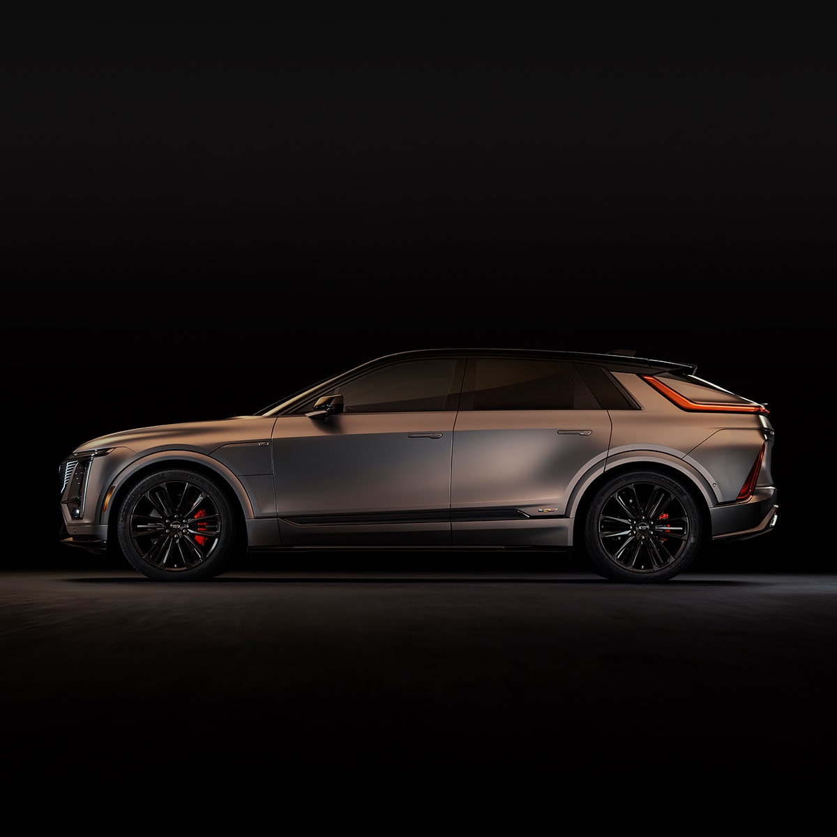 Side view of the 2026 Cadillac LYRIQ-V parked in a dim area.