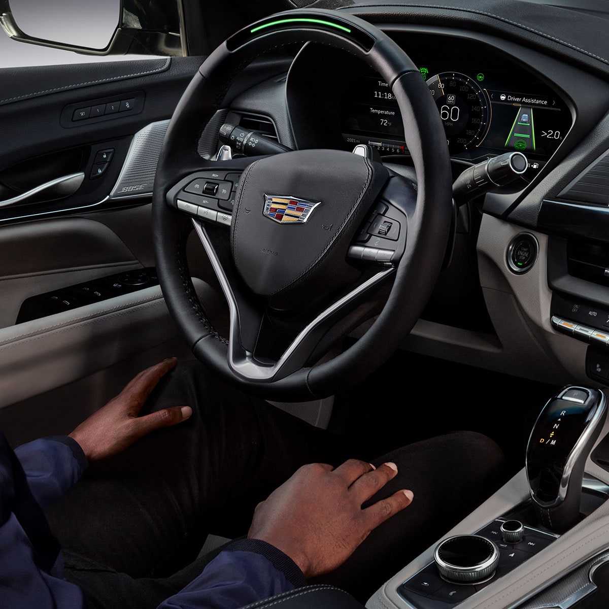 Close up of a person using the Super Cruise hands-free technology in driving the 2025 Cadillac CT4 luxury sedan.