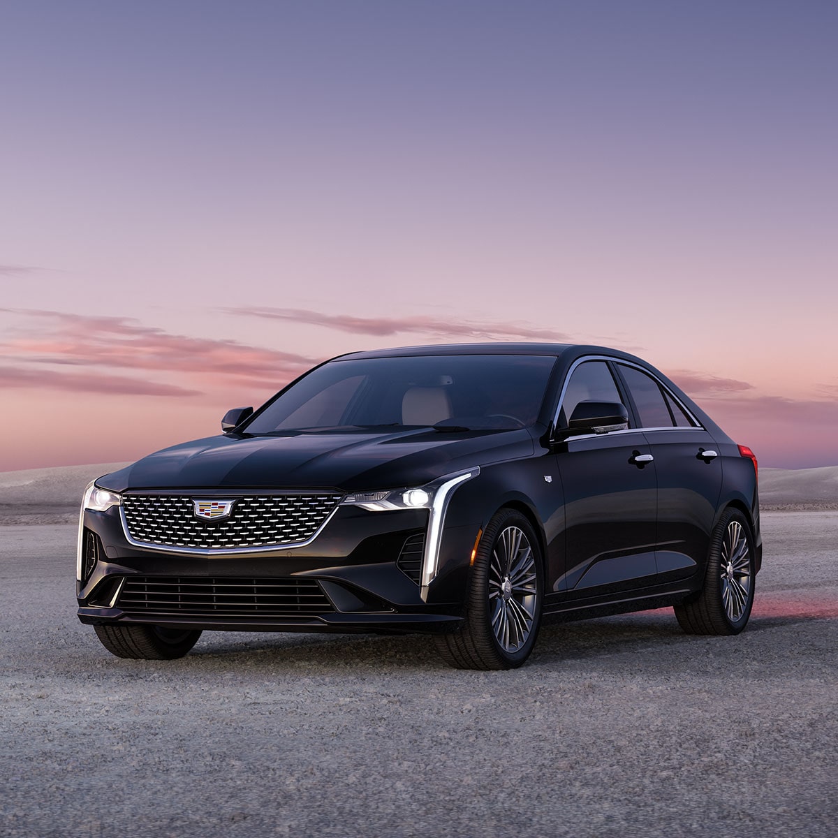 2025 Cadillac CT4 luxury sedan parked alone during sunset.