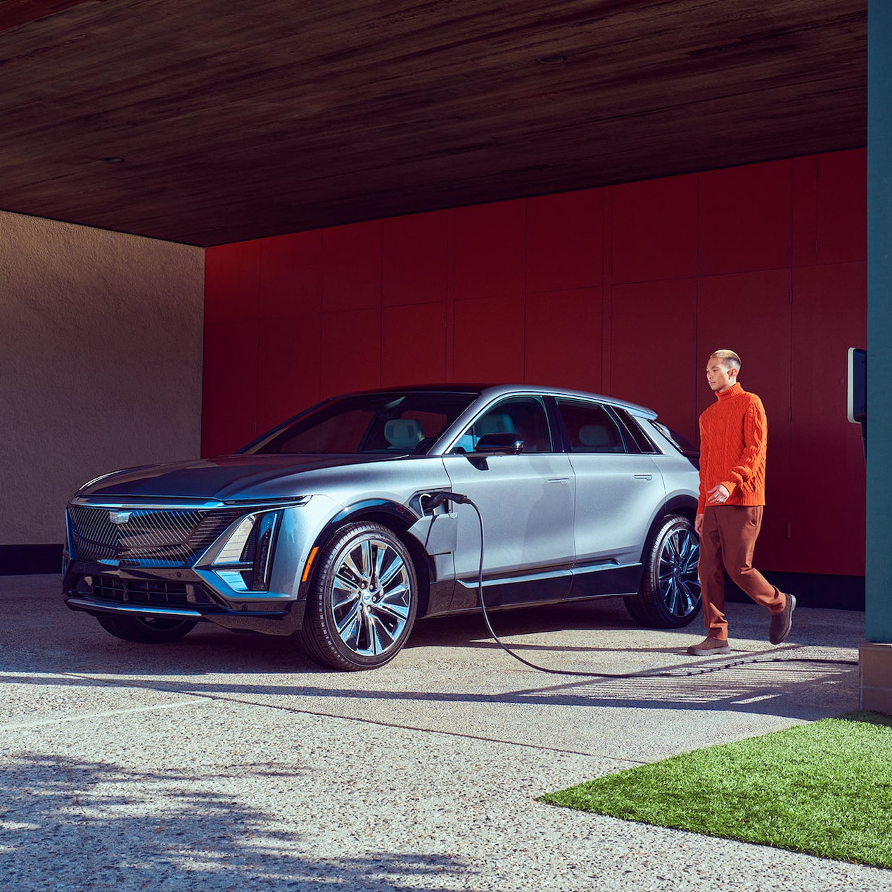 2024 Cadillac LYRIQ charging within a home garage: estimated  502 km range with a full charge.