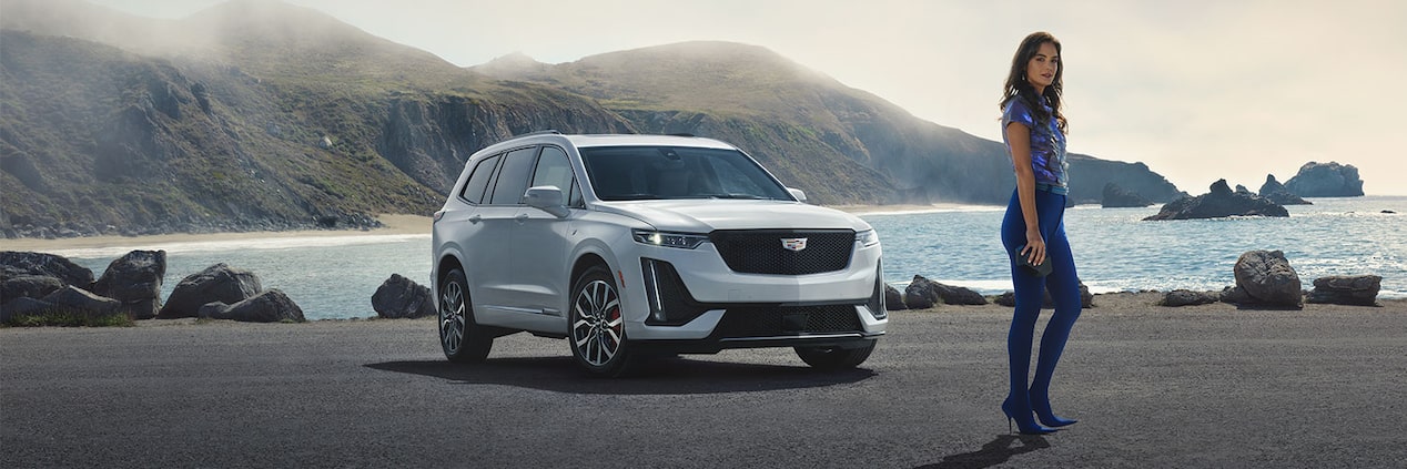 Scenic shot of the 2024 Cadillac XT6 parked by the water.