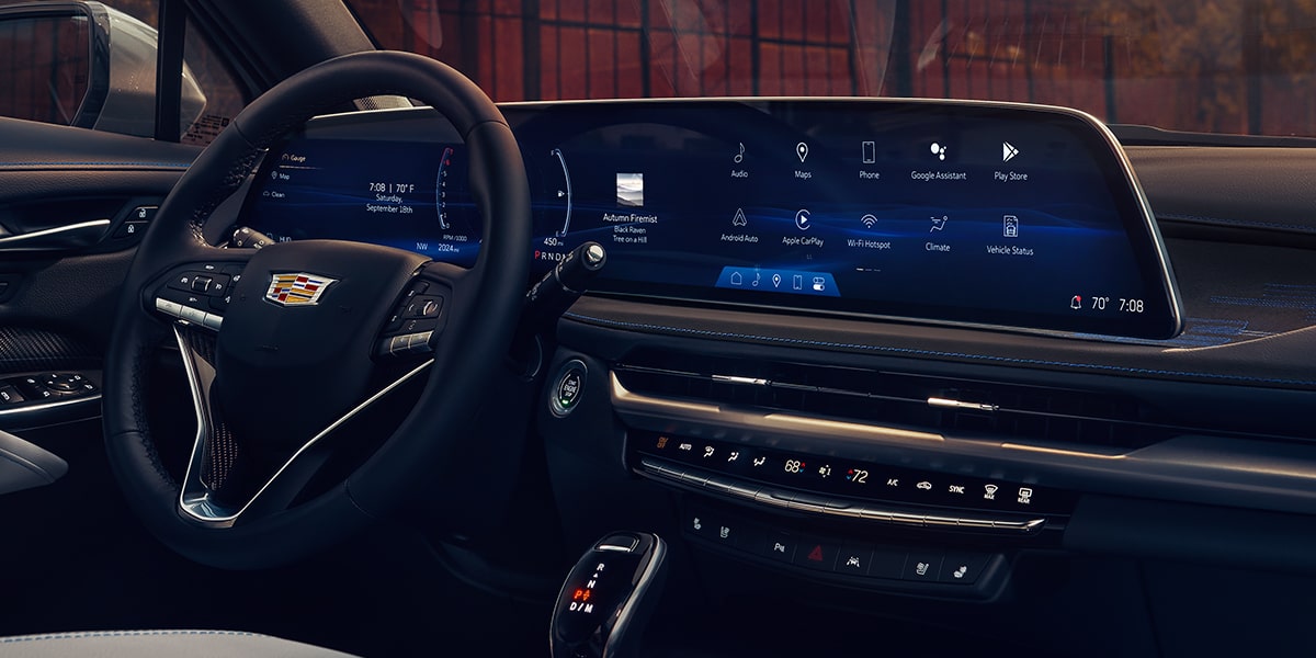 Driver's view of the steering wheel and the front interiors of the 2025 Cadillac XT4.