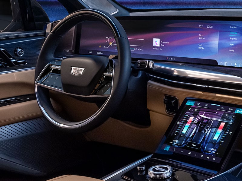 Close up view of the steering wheel and infotainment screen on the 2025 Cadillac Escalade IQ electric suv.