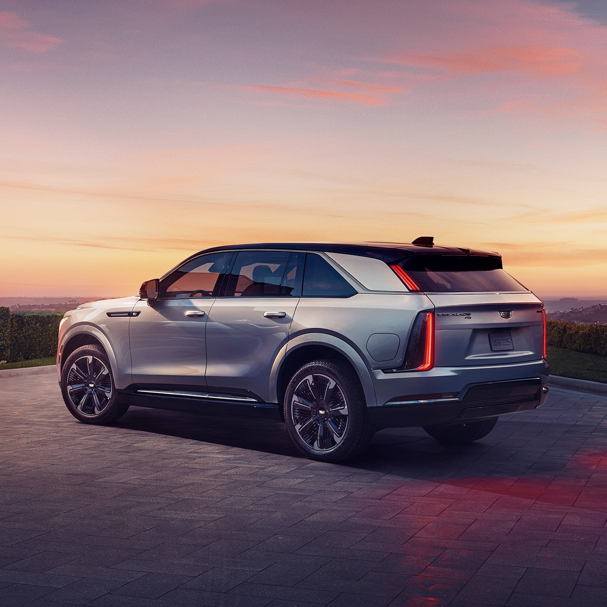 2025 Cadillac Escalade IQ electric suv parked alone during sundown.