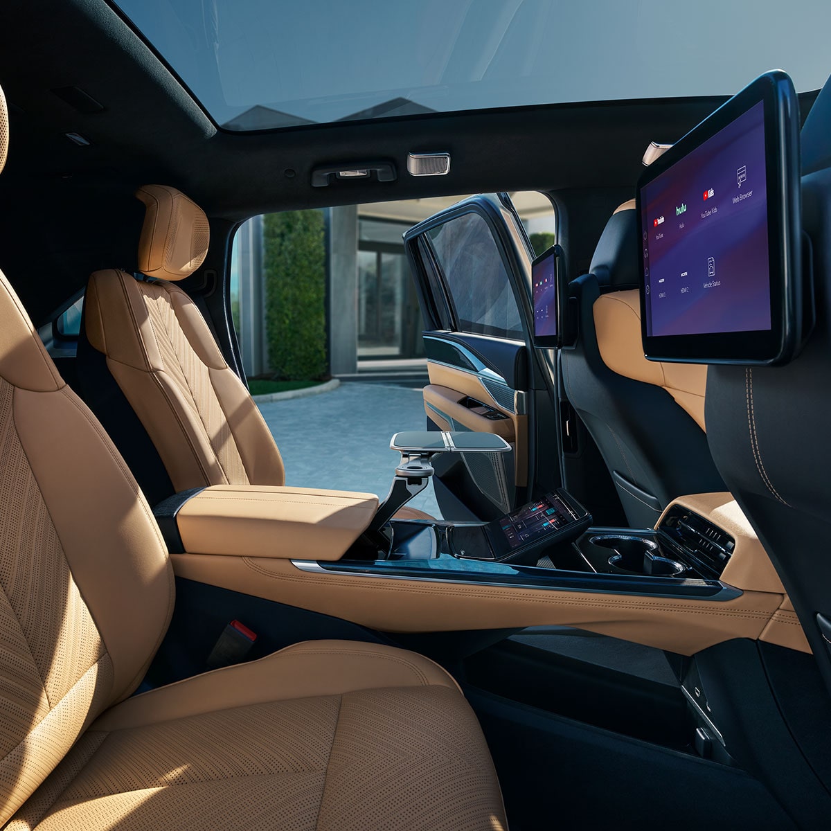 Side view of the rear passenger's seats with the tray tables unstowed on the 2025 Cadillac Escalade IQ electric suv.