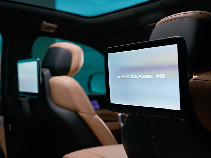 A person seated on the spacious second row of the 2025 Cadillac Escalade IQ electric suv.