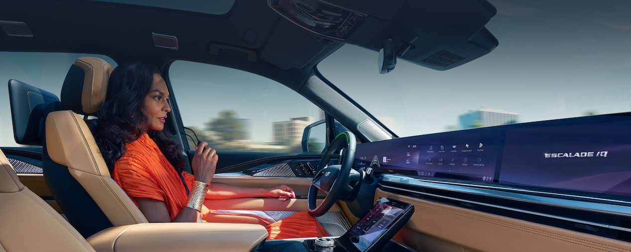 Side view of a person utilizing the Super Cruise technology inside the 2026 Cadillac Escalade IQL.