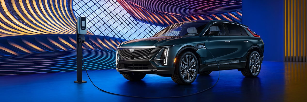 2024 Cadillac LYRIQ electric SUV while connected to a public charging unit.