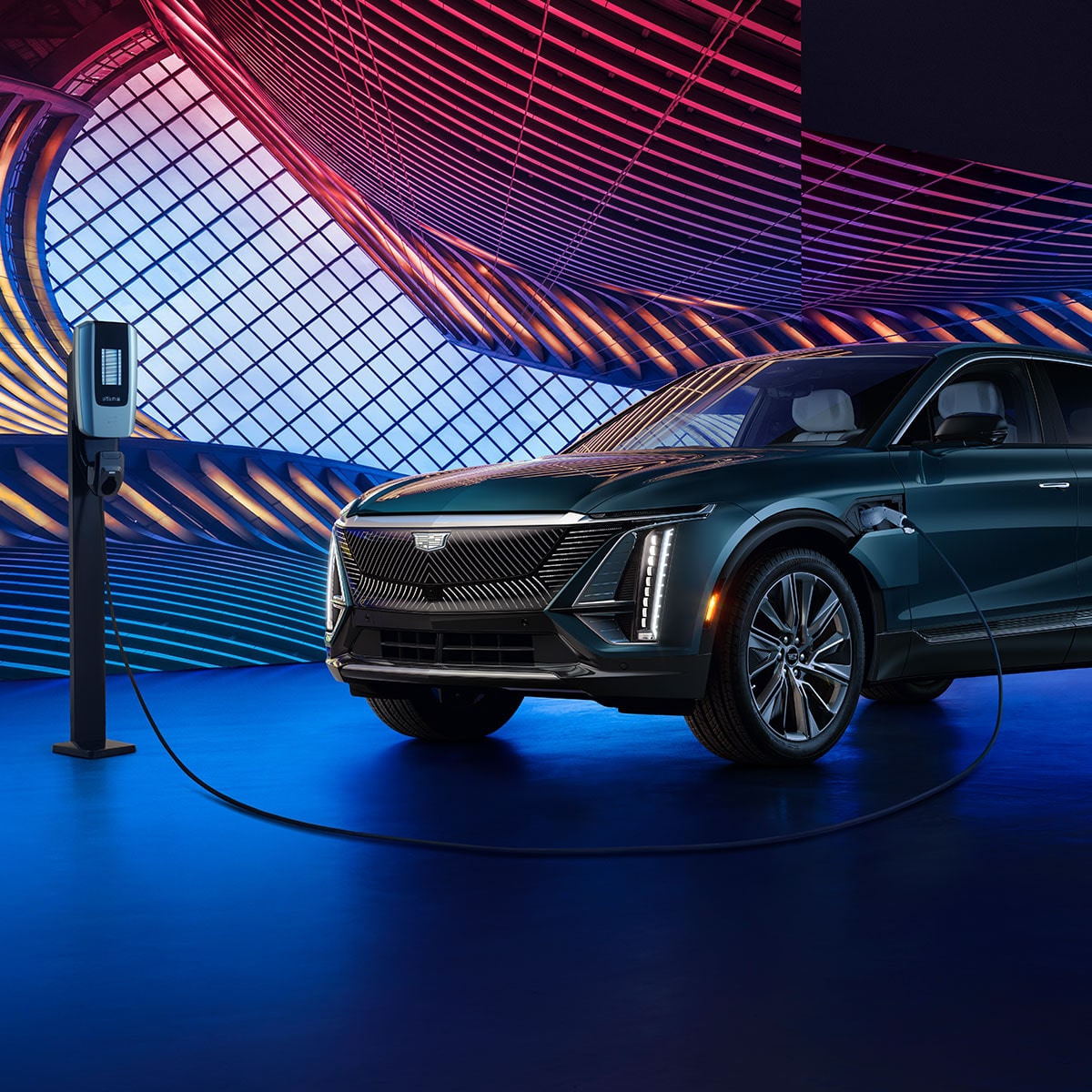 Scenic shot of the 2024 Cadillac LYRIQ while attached to a charging port.