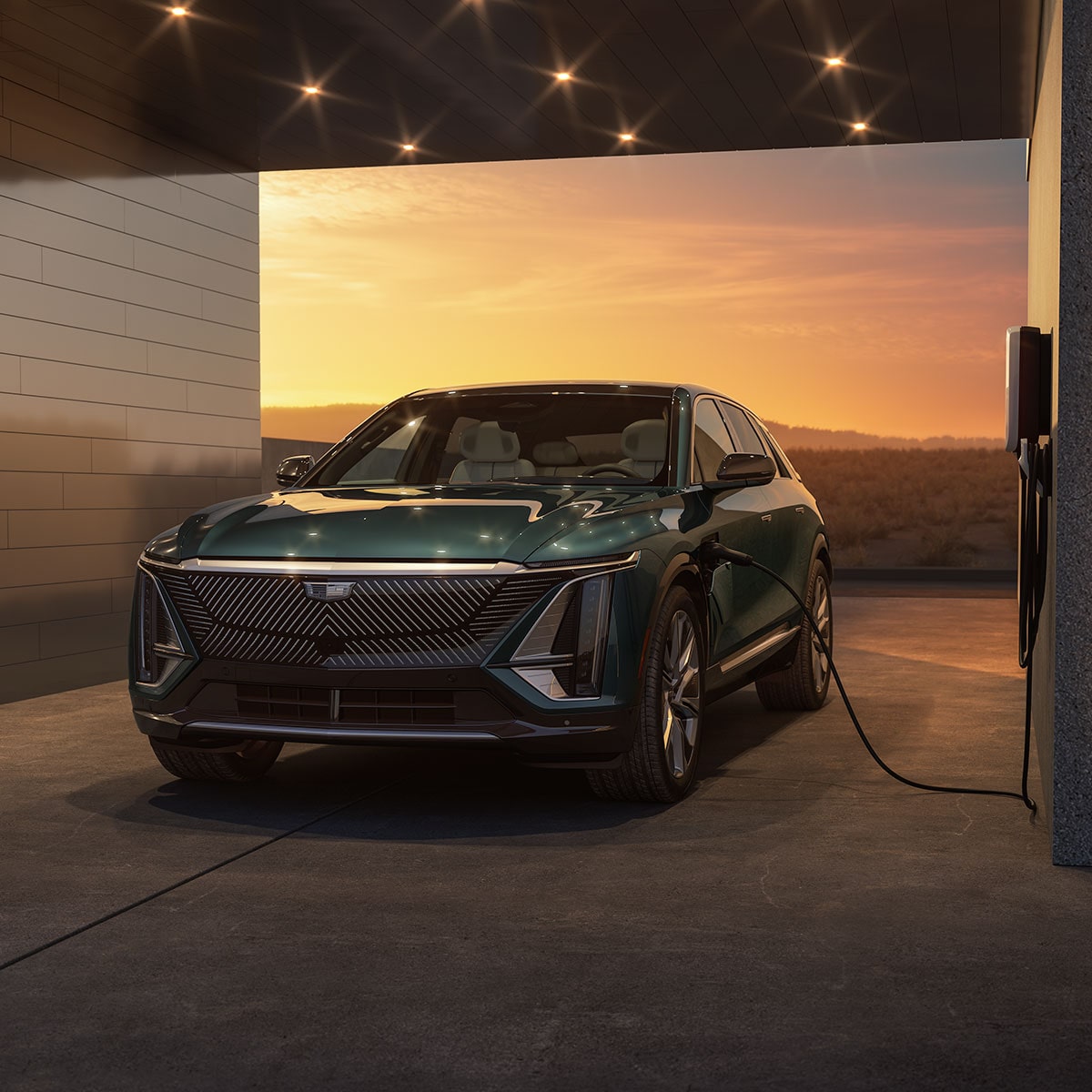 2024 Cadillac LYRIQ plugged into a public charging station: learn more about EV life here.