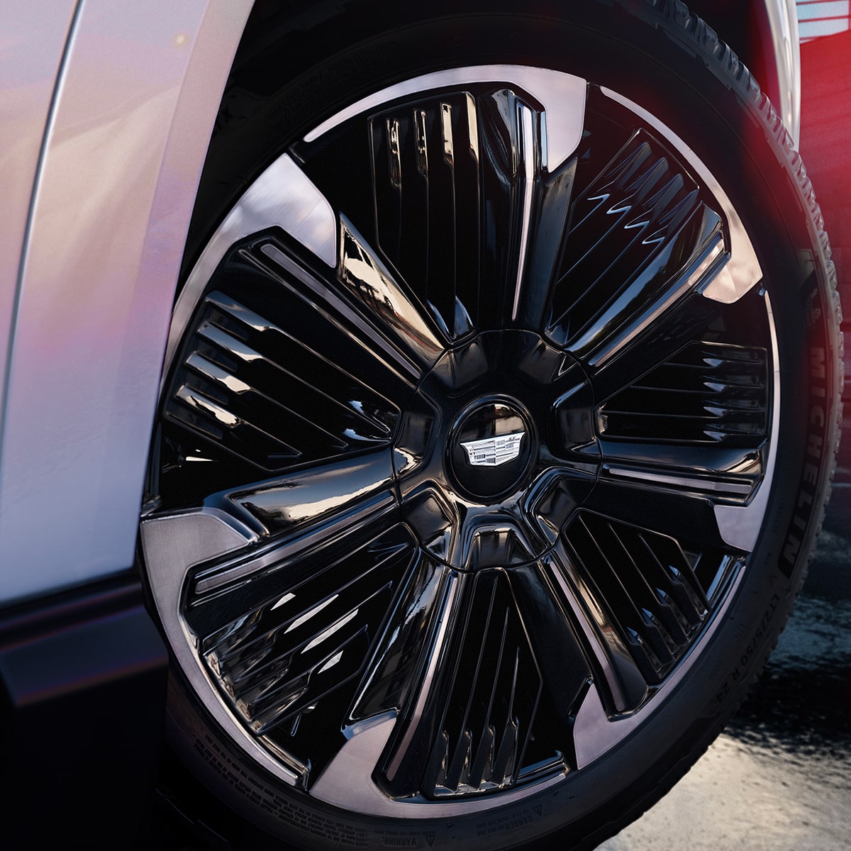 Zoomed view of the large metallic wheels of the Cadillac Escalade IQ.